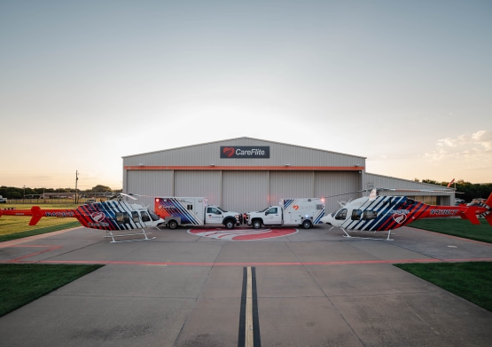 a group of airplanes parked on a runway